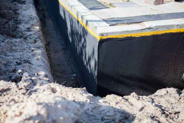 Professional Basement Waterproofing technician working in Newberg, OR
